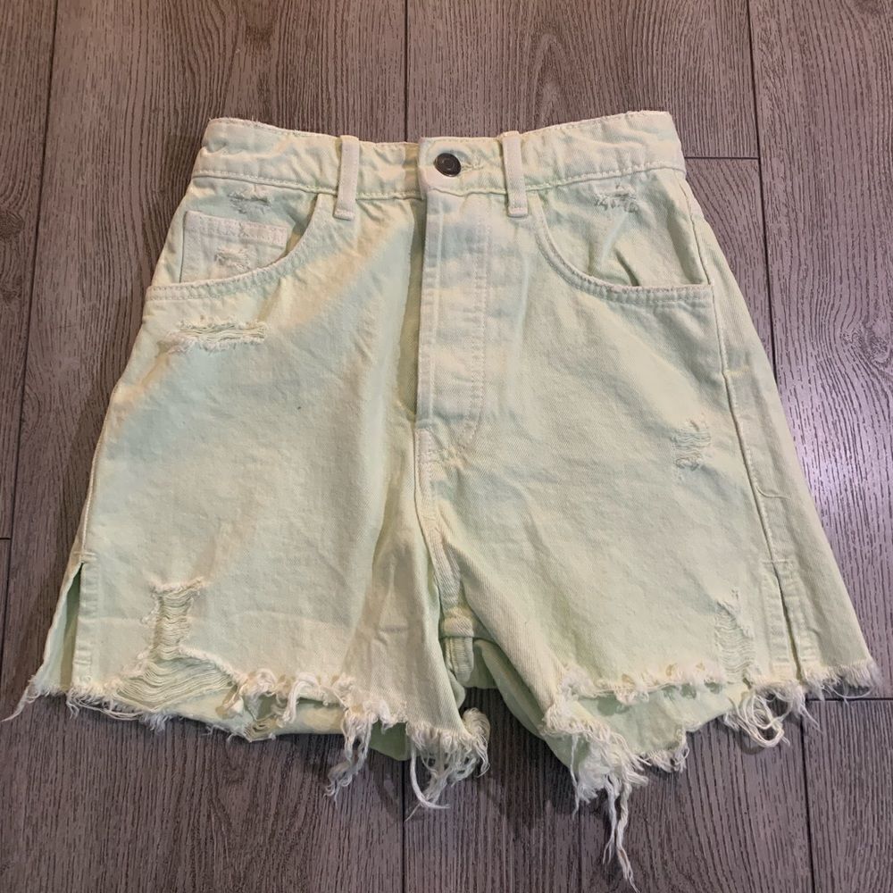 Zara woman’s high rise light green distressed jean shorts